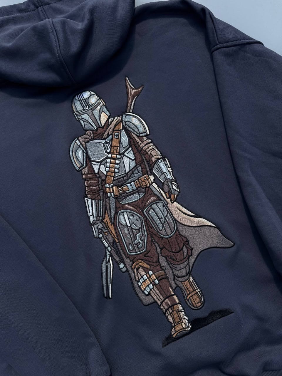 Character embroidery on garment